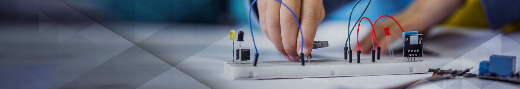 Child using breadboard for school science project